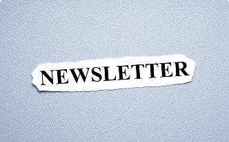 A cut out of the word Newsletter on a grey background