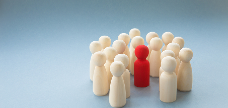 A red pawn surrounded by white pawns